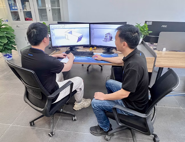 SYOCHI Technical Team Discussing Chiller Design